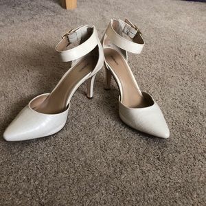 Cream heels with gold buckles